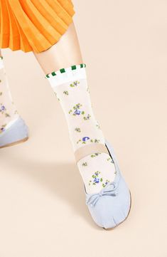 Delicate flowers and laced cuffs embellish these sheer crew socks that add a sweet detail to any ensemble. Nylon Hand wash, dry flat Made in Japan White Mid-calf Summer Socks, Cute Green Socks For Spring, Trendy White Socks For Spring, White Socks For Spring, Feminine Fitted Socks For Spring, Fitted Feminine Socks For Spring, Cute Lace Trim Socks For Spring, Summer White Socks With Lace Trim, Summer Lace Trim Fitted Socks