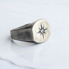 Silver stone compass men ring has been carefully designed and handcrafted for you, inspired by the unique pole star that shines brightly in the darkness of the sky. We presented our ring as white bronze (silver plated) or 925 sterling silver. This ring, which is suitable for daily use and at the same time very stylish, can be an anniversary gift or a memorial gift for your loved ones, and it will come properly packaged as a gift. As NuaSilverRings, we guarantee that we will help you with any pro Pinky Ring Mens, Rings Signet, Black Closet, Cool Rings For Men, Space Rings, Man Ring, Men Rings, Silver Ring Designs, Pole Star