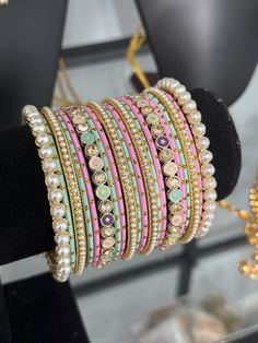 pearl kundan   bangles set for both hands. Pink Meenakari Wedding Bracelets, Pink Bollywood Bangle For Festivals, Pink Bangle For Festivals, Pink Meenakari Wedding Bangle, Pink Meenakari Bangle For Wedding, Pink Meenakari Bracelets For Festivals, Pink Bollywood Bracelets For Festivals, Festive Pink Meenakari Bangle, Pink Meenakari Bangle For Festivals