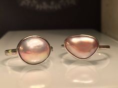 "Modern Pearl Ring. Unique Pearl Ring. Blush Pearl Ring. Solitare Pearl Ring. Trillion Pearl Ring. Pink Pearl Ring. Modern Pearl Ring. Beautifully Handcrafted upcycled bezel set Natural Cultured Pearl set on a lightly hammered solid sterling silver band.. This unique yet very versatile ring is a size 9 1/2 but is available in any size with a very similar Pearl and is sure to be your go to accessory and is perfect for wearing on any finger. . ❤️❤️Give the thoughtful gift of handcrafted. ❤️❤️ Grea Handmade Pink Ring In Fine Jewelry Style, Handmade Pink Rings In Fine Jewelry Style, Handmade Pink Fine Jewelry Ring, Unique Pink Open Ring, Pink Open Ring, Pink Teardrop Fine Jewelry Ring, Pink Moonstone Sterling Silver Ring For Anniversary, Pink Teardrop Anniversary Ring, Pink Oval Stackable Jewelry