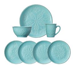 a set of four blue dishes and cups