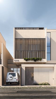 a car is parked in front of a building with wooden slats on the side