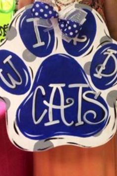 a blue and white dog paw shaped sign