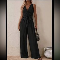 Fashionable Black Belted Jumpsuit - Chic Sleeveless, Wide Leg Design - Perfect For Spring & Summer Size M Bust: 37.8” Length: 56.5” Inseam: 27.6” Size 6 Elegant Black Jumpsuits And Rompers For Beach, Elegant Black Jumpsuit For The Beach, Jumpsuits For Women Classy, Olive Green Jumpsuit, Boutique Pants, Belted Jumpsuit, Belted Romper, Belt Jumpsuit, Jumpsuit Chic