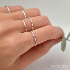 Jewelry by Katstudio. Dotted ring, sterling silver, silver ring 925, bead stacking ring, bead ring, connected dot ring, minimalist jewelry, kat studio Materials: sterling silver 925 Dimensions: beads 1.5mm  Finish: shiny polished. This ring can be made into size 2 to 10 US , including half sizes .  ★You may also like★ Simple ring:  https://www.etsy.com/ca/listing/113006585/simple-ring-sterling-silver-stacking Hammered ring: https://www.etsy.com/ca/listing/732091439/hammered-ring-sterling-silver- Handmade Minimalist Midi Rings With Round Band, Dainty Sterling Silver Midi Rings With Simple Design, Simple Handmade Stackable Rings, Minimalist Round Silver Beads Jewelry, Minimalist Silver Beads Round Jewelry, Tiny Sterling Silver Minimalist Stackable Rings, Delicate Sterling Silver Stackable Rings, Handmade Silver Minimalist Stackable Rings, Dainty Stackable Sterling Silver Midi Rings