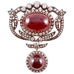 Purchased from famed Macklowe Gallery in 2009 for $15,000, this timeless treasure is as lovely now as it was then! In sterling silver over 14 karat yellow gold, with cabochon-cut garnets and a stated weight of 4.50 cts in diamonds, it can be worn as a brooch or as a lovely hair ornament! The lower drop portion can also be removed. Diamond Flower Brooch, Antique Silver Jewelry, Antique Brooches, Garnet Jewelry, Diamond Brooch, Royal Jewels, Brown Diamond, Antique Diamond, Victorian Jewelry