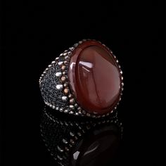 The elegant, smooth-textured red yemeni agate gemstone is much more than an eye-catching jewelry stone. It is said to have immense healing and spiritual properties.  Those purchasing these pieces will not only have the satisfaction of owning and wearing something special, but also allowing someone to continue creating something that they love. Tim's Silver gives you the meaning and the properties of this gemstone ring. PRODUCT DETAILS Metal : 925k Sterling Silver Stone : Yemeni Agate Style : Mid Formal Agate Rings With Natural Stones, Luxury Agate Rings, Unique Wooden Boxes, Man Rings, Men Silver Ring, Aqeeq Ring, Jewelry Stone, Agate Jewelry, Real Stone