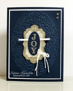 a blue and gold card with the word joy on it