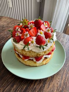 there is a cake with strawberries on top