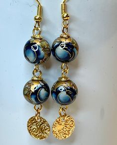 Vintage Japanese Tensha Blue Rose Beads 1970, Vintage Gold Plated Ornate Etched Medallion Dangles 1960,Gold Plated Ear Wires Two exquisite vintage Japanese tensha beads boast dark lapis blue colored roses outlined in gold foil. If only such a rose existed! ◉ As a point of information : "Tensha" in Japanese means "transfer" in English. Japanese Tensha beads are lightweight and were handmade by applying a beautiful detailed decal to an acrylic or porcelain bead. This bead is then sealed with an acrylic coating to protect it. We purchased these beads in London during the early 1980's and they are definitely vintage tensha beads from over 40 years ago. Gold or silver foil accents are often used to highlight these stunning beads. These beads are approximately 10mm or 3/8"  in diameter and dangl Gold Elegant Beaded Earrings With Large Beads, Elegant Gold Beaded Earrings With Large Beads, Bohemian Gold Earrings With Polished Beads, Tensha Beads, Rose Outline, Colored Roses, Rose Beads, Vintage Gold Earrings, Rose Gold Beads