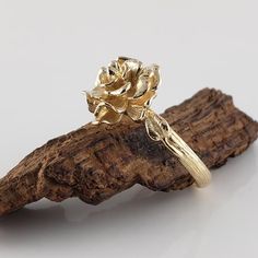 Made to OrderBeautiful Hand Sculpted Rose Ring cast in solid Gold with two small leaves on each side. Available in Sterling Silver, 14k or 18k Gold in Yellow, White, and Rose Gold  (Silver $150, message for customer purchase link)Size: Rose is 14.23mm wide         Band width is 2.66mm● Gold rings will come a black velvet ring box.● Silver Rings will come in a mesh tote and gift box. dvjewelrydesigns.comDawn Vertrees Jewelry...Elegance Uncut.#168 Flower Ring Jewelry, Gold Flower Ring With Rose Design, Gold Rose Design Flower Ring, Rose Flower Ring For Wedding, Gold Flower Ring With Rose Design For Wedding, Wedding Gold Flower Ring With Rose Design, Rose Engagement Ring Flower, Engagement Ring Photoshoot, Rose Ring Flower