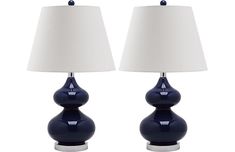 two blue lamps sitting next to each other