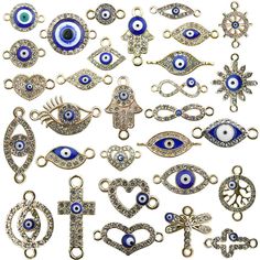 an assortment of evil eye charms and brooches, all in gold with blue eyes