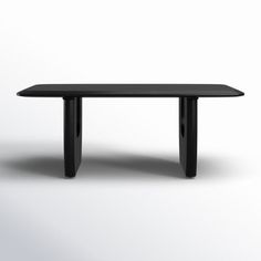 a black table sitting on top of a white floor