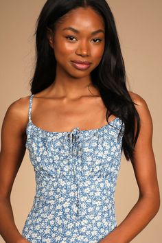 Everyone knows a little day dress can be a true wardrobe hero, and the Lulus Daisy Days Blue Floral Empire Waist A-Line Mini Dress is here to save the day! Lightweight woven fabric, decorated with a simple floral motif, shapes this flirty little dress. A tying drawstring neckline creates a keyhole detail as it tops the gathered bodice atop the empire waist. Adjustable spaghetti straps, a back zipper, and a sweet A-line skirt finish the look. Fit: This garment fits true to size. Length: Mid-thigh Blue Maxi Dress With Ditsy Floral Print For Summer, Light Blue Ditsy Floral Summer Dress, Blue Sundress With Tie Straps For Daywear, Blue Midi Dress With Ditsy Floral Print For Summer, Blue Sundress With Tie Straps, Blue Ditsy Floral Print Square Neck Dress, Blue Sundress With Tie Straps For Spring, Blue Mini Dress With Tie Straps For Spring, Blue Mini Dress With Tie Straps And Square Neck