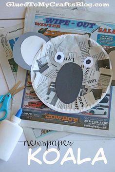 paper plate mouse craft with newspaper and scissors