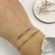 Instantly imbue your after-dark look with endless glamour courtesy of this POPI Double Chain Bracelet. Rather than being trendy, the delicate and dainty POPI won't be going out of style anytime soon. Crafted from high-quality material, the gold or silver finish brings sparkling sophistication to your ensemble when wrapped around the wrist, it makes the perfect signature sign-off for any ensemble. Features: Lightweight feel Super elegant Very comfortable High quality Hypoallergenic Delicate curb Trendy Charm Bracelet With Delicate Chain, Trendy Adjustable Charm Bracelet With Delicate Chain, Sterling Silver Adjustable Chain Bracelet For Party, Minimalist Sterling Silver Chain Bracelet For Party, Adjustable Sterling Silver Chain Bracelet For Party, Dainty Adjustable Silver Chain Bracelet, Adjustable White Gold Trendy Bracelet, Chic Sterling Silver Bracelet As A Gift, Chic Sterling Silver Bracelet Gift