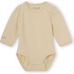 Onesie in a soft organic pointelle jersey from MINI A TURE. The onesie has long sleeves and snap-button at bottom and shoulder. This product is made in 100% organic cotton and is GOTS-certified, which means that the product is manufactured in a sustainable and socially responsible way from cotton-seed to final product. More color options available | Mini A Ture | Organic Akeleje Body, Marzipan (Beige, Size 1M)  |  Maisonette collects the best children’s products from around the world (unlike Zul Beige Long Sleeve Cotton Onesie, Cream Long Sleeve Onesie For Loungewear, Fitted Organic Cotton Long Sleeve Onesie, Fitted Long Sleeve Organic Cotton Onesie, Spring Organic Cotton Fitted Bodysuit, Casual Long Sleeve Cream Onesie, Cream Long Sleeve Cotton Onesie, Cream Cotton Bodysuit For Loungewear, Beige Long Sleeve Onesie For Loungewear