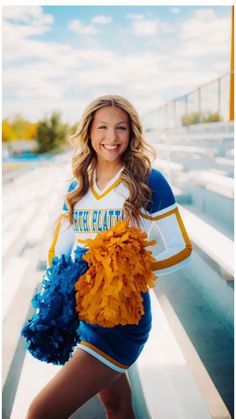 a girl in a cheerleader uniform holding a pom pom and posing for the camera