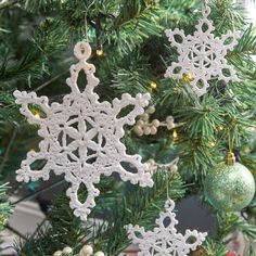 an ornament is hanging from a christmas tree