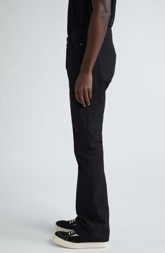 Rick Owens brings his signature rock edge to classic slim-fit pants revamped with an understated bootcut silhouette and medium-weight twill fabrication. 33" inseam; 19" leg opening; 11" front rise; 15" back rise (size 34) Button fly Five-pocket style 100% polyester Dry clean Made in Italy Designer Clothing Modern Slim Fit Straight Leg Pants, Classic Fitted Flare Jeans With Belt Loops, Fitted Classic Flare Jeans With Belt Loops, Fitted Bottoms With Five Pockets And Straight Silhouette, Modern Fitted Straight Bottoms, Straight Fit Cotton Bottoms With Straight Silhouette, Casual Black Straight Silhouette Bottoms, Casual Black Bottoms With Straight Silhouette, Classic Black Straight Flare Jeans