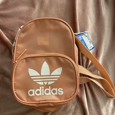 Brand New Adidas Backpack (Pink/Peach With White Logo) The Bag Is New With Tags Pink Adidas Backpack For Daily Use, Adidas Pink Backpack For Daily Use, Sporty Pink Shoulder Bag With Removable Pouch, Casual Pink Crossbody Backpack, Pink Adidas Travel Backpack, Casual Pink Shoulder Bag For Back To School, Sporty Pink Shoulder Bag For School, Casual Pink Satchel Backpack, Pink Adidas School Backpack