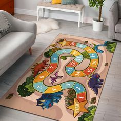 a rug with dinosaurs and numbers on it in a living room next to a couch