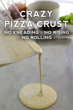 a pizza crust being poured into a pan with the words crazy pizza crust no kneading - no rising - no rolling