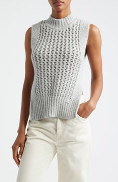 The Italian label's signature blend of relaxation and luxury shines in this alpaca-kissed sweater-tank boasting ribbed edges and an ornate openwork body. Mock neck Side slits 48% alpaca, 23% metallic fibers, 21% polyamide, 8% wool with 55% cotton, 45% polyester contrast Dry clean or machine wash, dry flat Made in Moldova Designer Clothing Chic High Neck Cashmere Top, Elegant Cable Knit Cashmere Tops, Pointelle Knit Crew Neck Sweater Vest, Chic Pointelle Knit Vest, Casual Sleeveless Cashmere Tops, Chic Open Knit Sweater Vest, Fall Cashmere Pointelle Knit Top, Sleeveless Cashmere Top For Layering, Sleeveless Open Knit Sweater