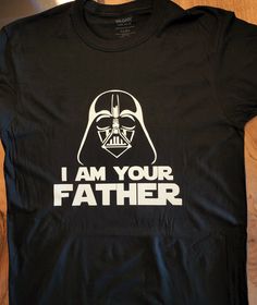 "This is a total custom-made shirt. 100% cotton, comes in a variety of sizes and colors. You can personalize it, otherwise it will include the default message \"I AM YOUR FATHER\"" Cotton T-shirt With Letter Print For Fan Conventions, Fitted T-shirt With Custom Print For Fan Merchandise, Fitted Short Sleeve T-shirt For Father's Day, Black Pre-shrunk Shirt For Fan Conventions, Cotton T-shirt With Text Print For Fan Conventions, Unisex Black T-shirt For Father's Day, Black Unisex T-shirt For Father's Day, Father's Day Fan Merchandise T-shirt With Crew Neck, Custom Print Fitted T-shirt For Fan Merchandise