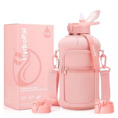 a pink baby bottle next to its packaging