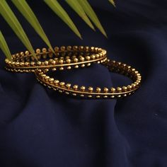 Description: Inspired by the rich tribal culture, this bangle by Tarinika is eclectic and has an earthy feel to it. It is gold plated with oxidized finish to give the definite earthy charm. Style with other jewelry from Maati Collection for a complete look. Details & Specifications: Materials used: Brass Alloy with Antique Gold Plating Weight -Bangles: 2.6- 45 gm Length - Bangles: 2.6- 6 cm Make it custom Want to make it a custom bangle? Sure! Reach out to us at support@tarinika.com and we’ll be Custom Bangle, Jewellery Photography Inspiration, Jewellery Photography, Jewelry Photography, Gold Bangles, Gold Plating, Antique Gold, Antique Jewelry, Photography Inspiration