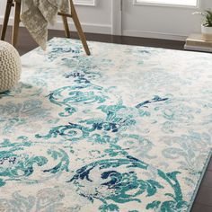 a blue and white rug in a living room