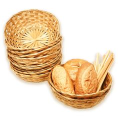 some bread and sticks in a basket on a white background