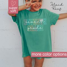 - This Is A Premium Youth Comfort Colors® Shirt - 8/7/24 PLEASE READ INFORMATION BELOW:  Get your kids ready for the first day of school with our Comfort Colors® Seventh Grade Kids Shirt, perfect for any 7th grader! This 7th Grade Youth Shirt is an ideal gift for elementary school students, offering comfort and style as a top choice for back to school tees.  Our Seventh Grade TShirt is designed for both boys and girls, making it a great gift for 7th grade kids. Shop now for the best Seventh Grad Green School Spirit Tops For School, Green Short Sleeve School Shirt, Green Short Sleeve Shirt For School, Green Graphic Print Tops For School, Green Pre-shrunk Shirt For School, Green Letter Print Top For School, Green Graphic Print Top For School Spirit, Green Tops With Graphic Print For School Spirit, Green Short Sleeve Top For School Spirit