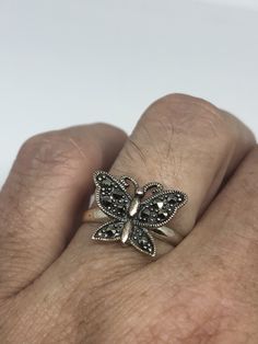 Vintage hand made Marcasite set in 925 Sterling Silver ring I have size 6.75 Can be re sized for you, my jeweler charges $10 All rings are shipped in a nice gift box. Check out our over a THOUSAND great reviews Engraving is $4 per letter and is not always perfect depending on the piece. It can take a few days if the jeweler is busy. This is payable to Paypal Judithsltd@gmail.com Nickel-free Sterling Silver Butterfly Ring Gift, Handmade Sterling Silver Butterfly Ring For Anniversary, Sterling Silver Hallmarked Butterfly Wedding Ring, Sterling Silver Hallmarked Butterfly Ring For Wedding, Formal Sterling Silver Butterfly Ring In Silver Color, Formal Silver Butterfly Ring In Sterling Silver, Formal Silver Sterling Silver Butterfly Ring, Adjustable Sterling Silver Butterfly Ring For Anniversary, Vintage Sterling Silver Butterfly Ring For Anniversary