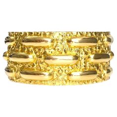 Introducing the David Webb Vintage Wide Bangle Cuff, a stunning piece crafted from 85 grams of 18k yellow gold. This exquisite cuff embodies timeless elegance and sophistication, showcasing David Webb's renowned craftsmanship and design expertise. The vintage-inspired wide bangle cuff exudes luxury, making a bold statement on any wrist. Whether worn alone or layered with other pieces, this David Webb creation is a true testament to the beauty and allure of fine jewelry craftsmanship. Modern Yellow Gold Wide Band Bracelet, Hallmarked Yellow Gold Cuff Bracelet For Formal Occasions, Formal Hallmarked Yellow Gold Cuff Bracelet, Gold Cuff Bracelet With Jubilee Detail For Formal Events, Gold Cuff Bracelet Jubilee Style For Formal Occasions, Formal Yellow Gold Hallmarked Cuff Bracelet, Gold Cuff Bracelet With Jubilee Design For Formal Events, Formal Gold-plated Polished Cuff Bracelet, Gold-plated Polished Cuff Bracelet For Formal Occasions