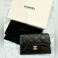 New In Box Chanel Caviar Black Cardholder. Stickers In Tact, Bought In Paris At The Original Chanel Store In Rue Cambon Which Is Why It Is In A White Box. Full Set, Ribbon, Camelia. Price Firm, Posh Will Authenticate! Elegant Black Card Holder As Gift, Elegant Black Compact Card Holder, Luxury Black Card Holder For Formal Occasions, Luxury Black Card Holder For Evening, Luxury Black Evening Card Holder, Elegant Formal Card Holder With Original Box, Chanel Store, Key Pouch, Girly Bags