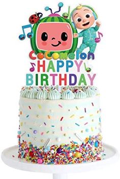 a birthday cake with sprinkles and an image of a cartoon character on top