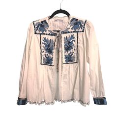 Nwt I Love This Jacket And I Have Never Worn It. It Is Time I Part Ways With This Jacket I Bought For A Vacation. The Details Are So Fab:L Fringe, Metal Tassel, Tie At Neck, Stitch And Fringe At Hem, Embroidered Trim Sleeve Cuffs, Cross Stitch Embellishment. Size M 100% Cotton Blue Spring Tops With Tassel Ties, Blue Spring Top With Tassel Ties, Blue Long Sleeve Outerwear With Tassels, Blue Spring Outerwear With Tassels, Spring Blue Outerwear With Tassels, Blue Outerwear With Tassels For Spring, White Spring Outerwear With Tassels, White Long Sleeve Outerwear With Tassels, Zara Embroidered Blouse For Fall