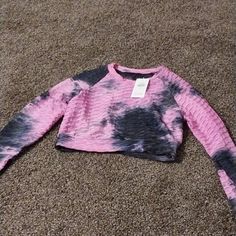 It Is Brand New Size L/Xl Pink And Black Scrunch Type Material And Tye Dye. I Paid 59.99 For It. It Still Has The Original Tags. Never Been Worn. Pink Gym Tops For Spring, Trendy Pink Sports Crop Top, Pink Stretch Long Sleeve Crop Top, Pink Athleisure Crop Top For Spring, Pink Long Sleeve Stretch Crop Top, Pink Long Sleeve Crop Top Casual Style, Pink Long Sleeve Casual Crop Top, Pink Sports Crop Top, Pink Crop Top For Workout