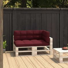 a couch and table on a wooden deck