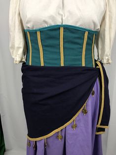 a woman's dress with two different colors and designs on the waist, one is blue