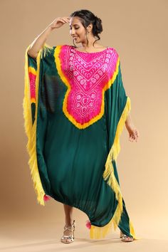 Fuchsia, yellow, bottle green bandhani gajji silk kaftan with yellow thread tassel details.
Components: 1
Type Of Work: Bandhani
Neckline: Round
Sleeve Type: Kaftan sleeves
Fabric: Gajji silk
Color: Yellow, FUCHSIA, Green
Other Details: 
Thread tassel detailing
Occasion: Party - Aza Fashions Festive Green Dress With Tassels, Festive Green Tassel Dress, Green Kaftan For Festivals With Traditional Drape, Bohemian Traditional Wear With Bandhani Print, Traditional Kurta With Back Tassel Tie-up For Diwali, Bohemian Multicolor Traditional Wear With Dabka, Multicolor Bohemian Traditional Wear With Dabka, Green Kaftan For Festive Traditional Ceremonies, Kaftan With Dupatta For Traditional Ceremonies And Festivals