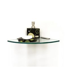 a glass shelf with a bottle on it