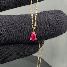 Solid Gold Ruby Pear Shape Pendant Necklace Product Features Weight: 1.30 Gr ⚖️ Material Colors: Yellow Gold, Rose Gold, and White Gold 🌈 Chain Length: 17 inch, 18 inch, 19 inch, 20 inch Stone Type: Ruby Shape: Pear 🌼 Presentation: Shipped with a special box and bag 🎁 Returns: Right to return within 7 days 🔄 Material and Color: Product color does not fade or darken ✨ Handcraftsmanship and Uniqueness: Handcrafted and may vary by 5% (+-) 🛠️ Ruby Information Ruby is a precious gemstone known a Fine Jewelry Ruby Necklace In Pear Shape, Fine Jewelry Ruby Drop Necklaces, Fine Jewelry Ruby Drop Necklace, Yellow Gold Ruby Teardrop Necklace, Yellow Gold Teardrop Ruby Necklace, Ruby Teardrop Pendant Necklace, Teardrop Ruby Necklace In Yellow Gold, Ruby Gemstone Teardrop Pendant Necklace, Pink Pear-shaped Gemstone Necklace