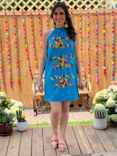 This Beautiful Halter Dress is the perfect Party dress. Its cute design and bold colors is the perfect combination, it also has elastic on the back for a tighter fit. The large florals are all hand embroidered which means the embroidered details vary on each dress, making them one of a kind. Available in more colors here: https://www.etsy.com/es/listing/761960040/vestido-halter-floral-vestido-bordado-a?ref=listings_manager_grid Purchase the earrings modeled here: https://www.etsy.com/es/listing/ Blue Floral Embroidered Mini Dress For Vacation, Blue Floral Embroidery Mini Dress For Vacation, Fitted Blue Fiesta Dresses, Blue Fitted Dress For Fiesta, Fitted Blue Dress For Fiesta, Blue Embroidered Summer Party Dress, Blue Embroidered Summer Dress For Party, Sleeveless Vacation Dresses With Embroidered Multicolor, Blue Embroidered Cotton Mini Dress