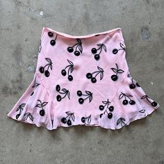 This printed mini skirt is super cute! Features flowy pink fabric, allover cherry print, and side snap closure. Lined. Love this for a night out , casual or dressed up. Size IT 38 Approximate measurements: Waist: 27" Length: 16" Trendy Fitted Skort For Brunch, Trendy Summer Mini Skort, Trendy Mini Hem Skirt For Summer, Flirty Mini Skirt For Summer Brunch, Flirty Summer Skort, Cute Mini Skort For Parties, Cute Mini Skort For Party, Cute Party Skort In Mini Length, Cute Mini Length Skort For Party