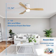 a living room with a ceiling fan and white furniture