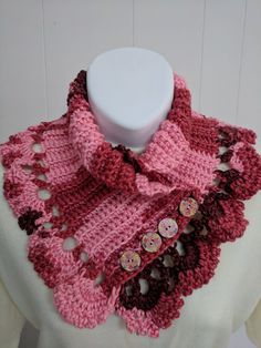 "This is a fabulous alternative to a scarf! Neck warmers hug your neck for warmth without all the fuss and length of a scarf. Crocheted in Caron Simply Soft yarn in a pretty blend of subdued pink and red. This folds over at the neck front with 4 wood floral buttons. There is a 2\" lace edging all around for a finishing touch. Cozy and warm, with stretch where needed. I used a super silky and soft acrylic yarn to keep this lovely neck warmer comfy and pretty. Makes a great gift idea or a treat fo Pink Knitted Fall Scarf, Pink Knitted Scarves For Winter, Pink Knitted Winter Scarves, Pink Crochet Scarves, Scarf Crocheted, Button Scarf, Neck Warmers, Caron Simply Soft, Scarf Neck